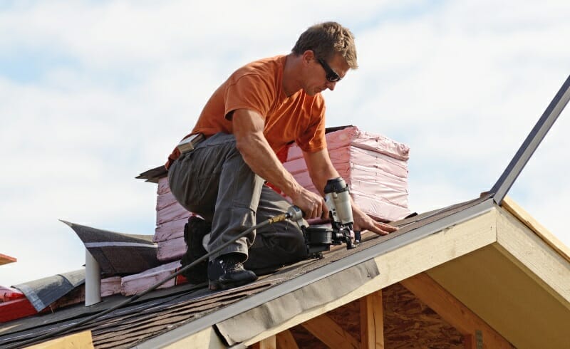 Roofing Specialist performing Roof Replacement Work